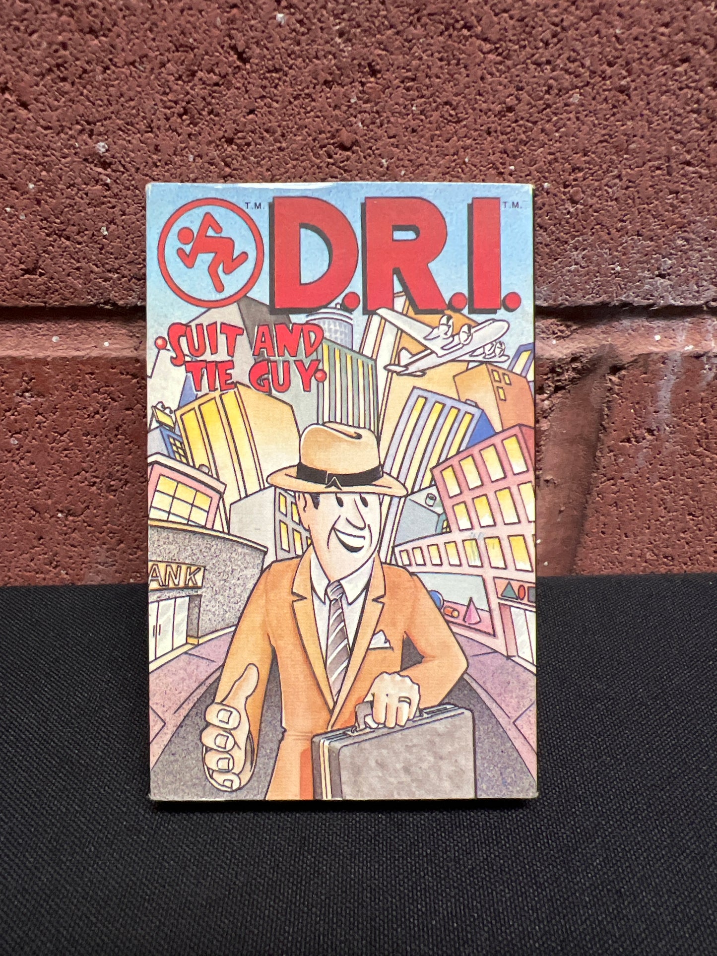 Used Cassette: Dirty Rotten Imbeciles (D.R.I.) "Suit And Tie Guy" Tape (Cassingle)