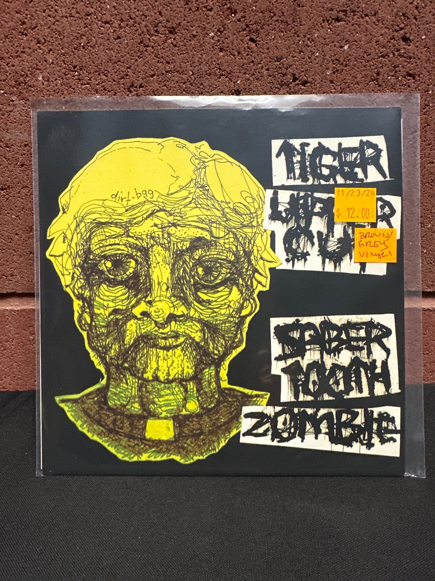 Used Vinyl: Tiger Uppercut! / Sabertooth Zombie "Tiger Uppercut! / Sabertooth Zombie" 7" (Colored vinyl)