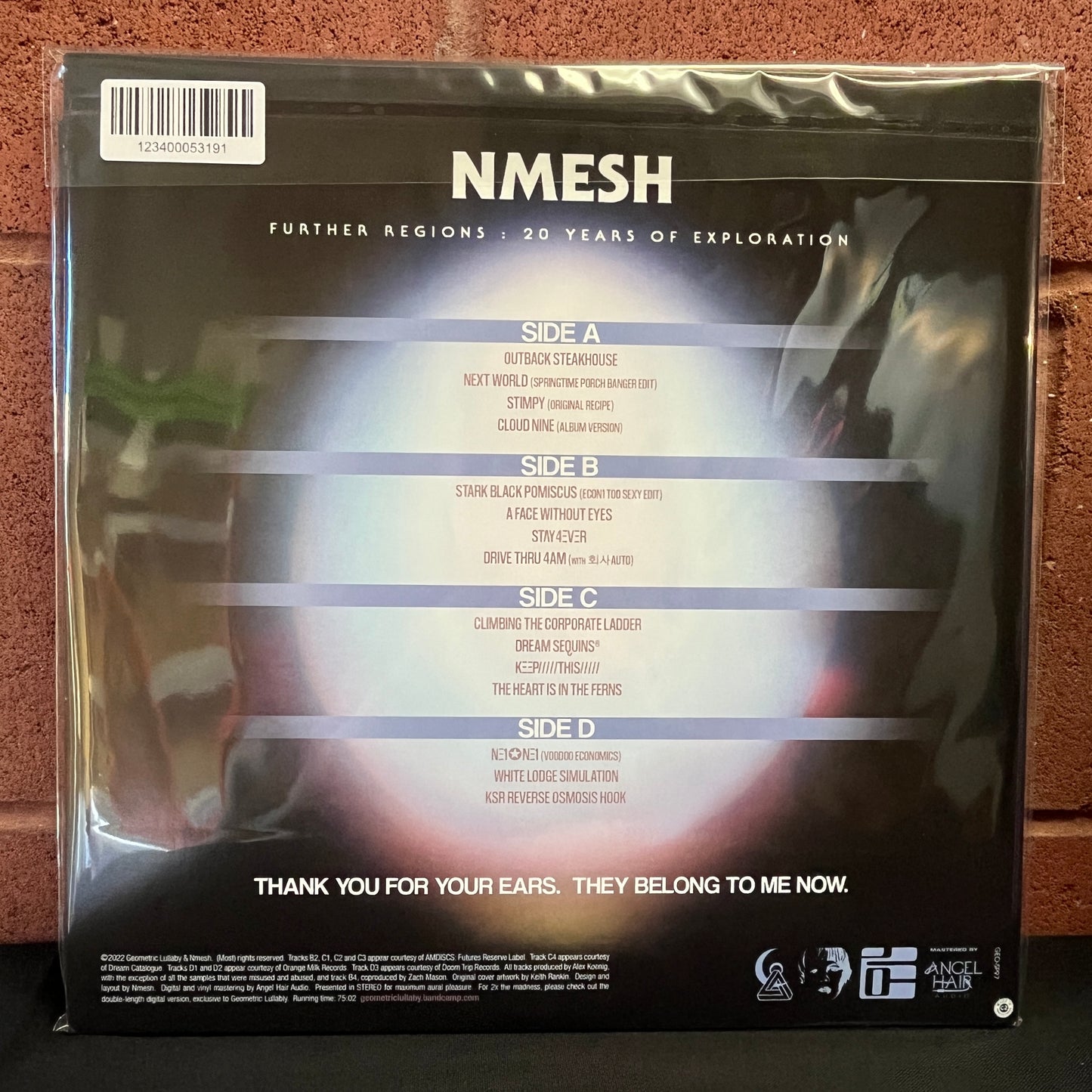 Used Vinyl: Nmesh "Further Regions: 20 Years Of Exploration" 2xLP (Black/Blue Split with Red Splatter vinyl)
