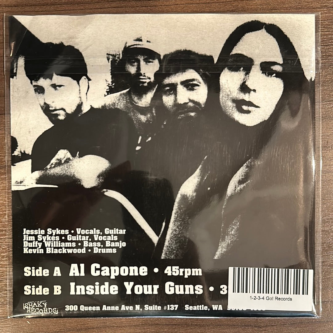 USED VINYL: Hominy “Al Capone / Inside Your Guns” 7"