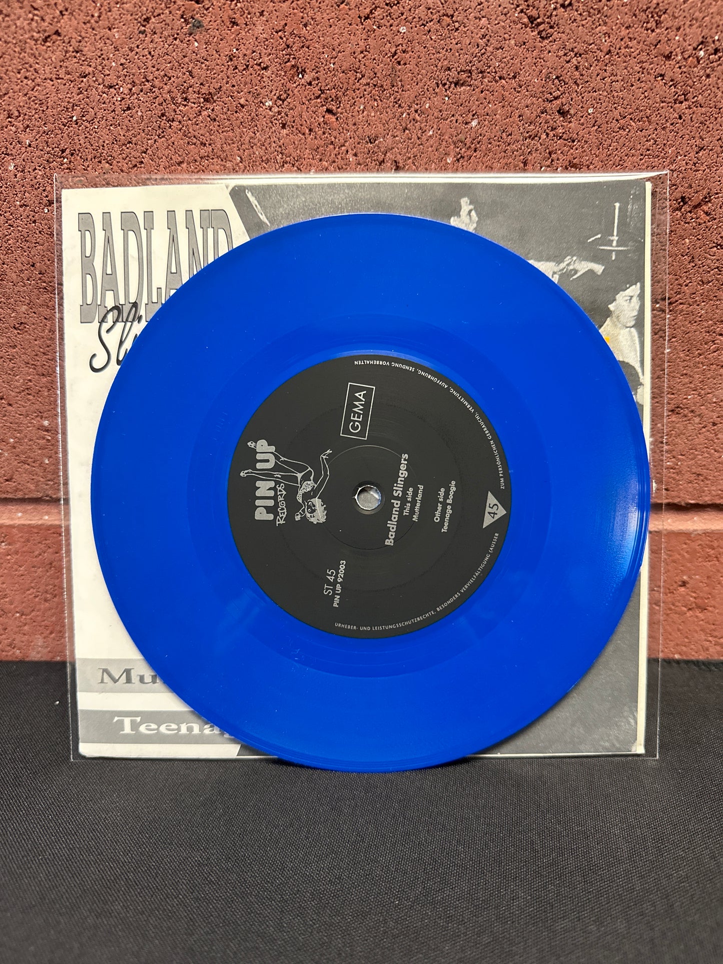 Used Vinyl:  Badland Slingers ”Mutterland / Teenage Boogie” 7" (Blue Vinyl)