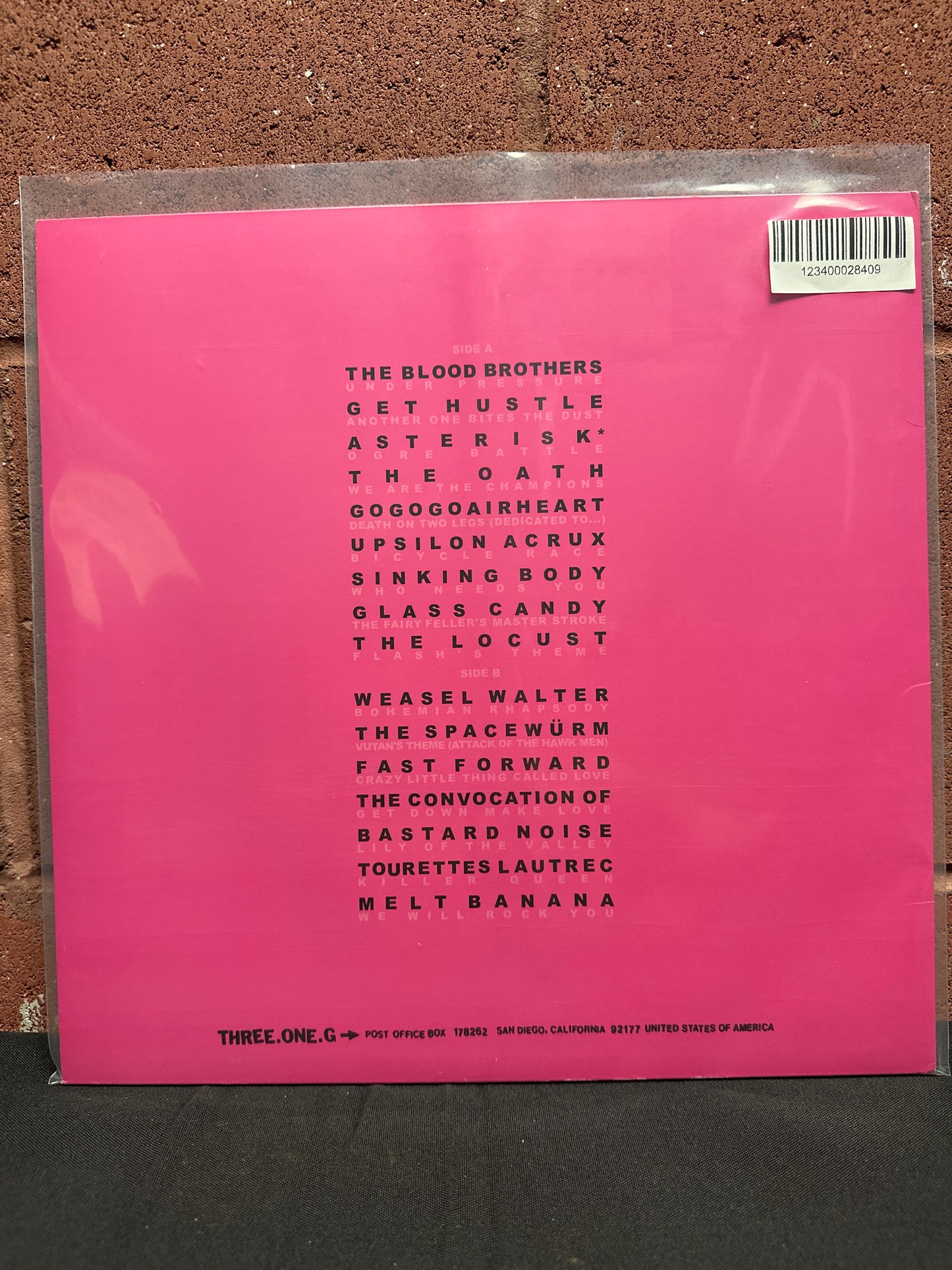 Used Vinyl:  Various ”Dynamite With A Laserbeam: Queen As Heard Through The Meat Grinder Of Three One G” LP (Pink vinyl)