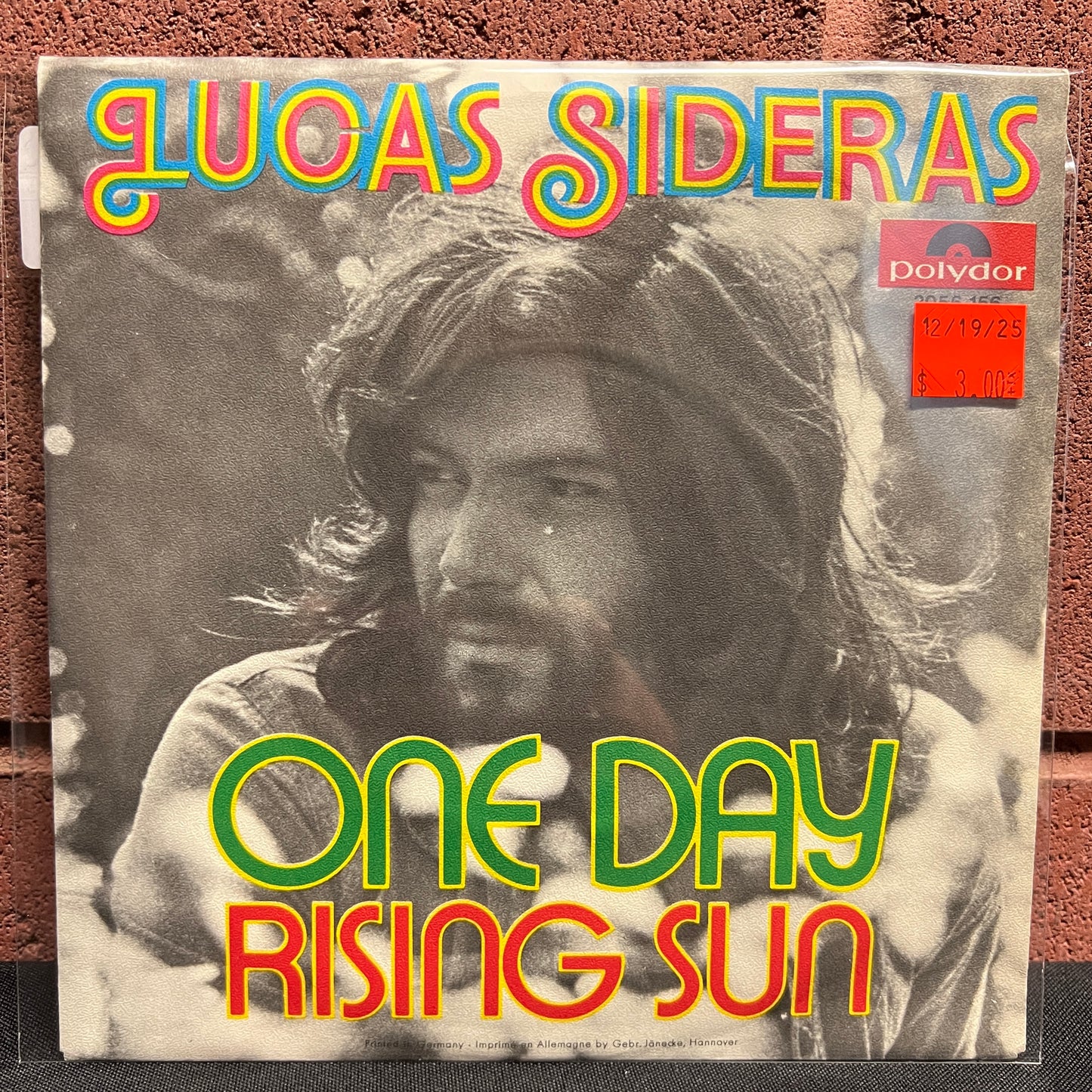 Used Vinyl: Lucas Sideras "One Day / Rising Sun" 7"
