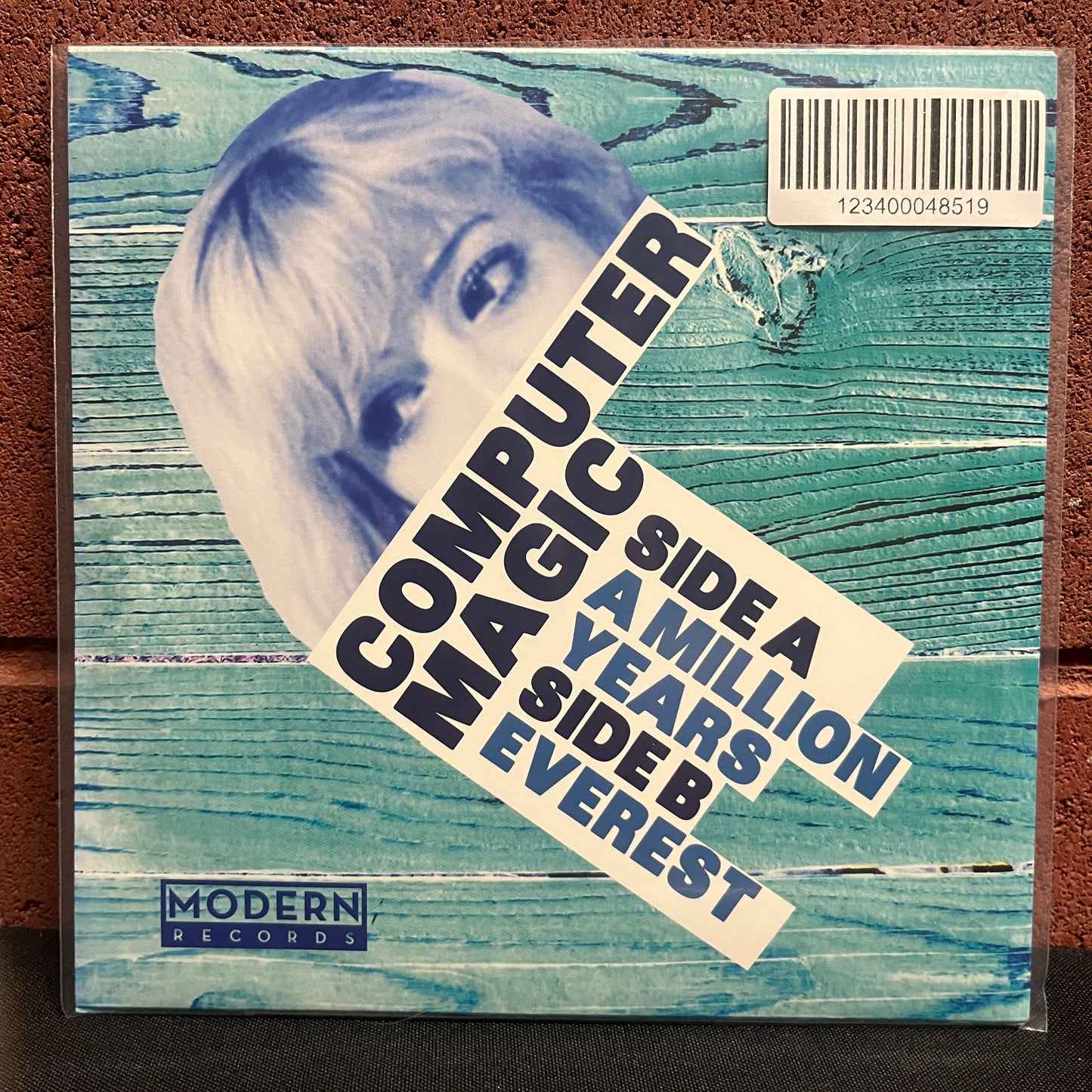 Used Vinyl: Computer Magic "A Million Years" 7" (Clear w/Blue & White Splatter Vinyl)