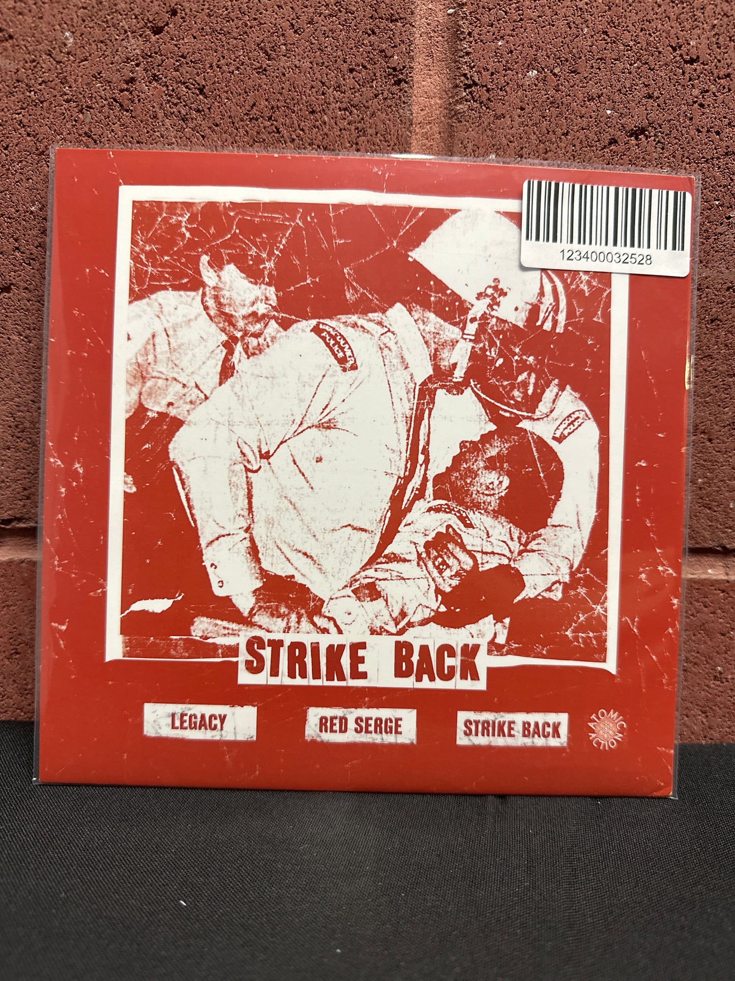 Used Vinyl:  Punitive Damage ”Strike Back” 7" (Pea Green Vinyl)