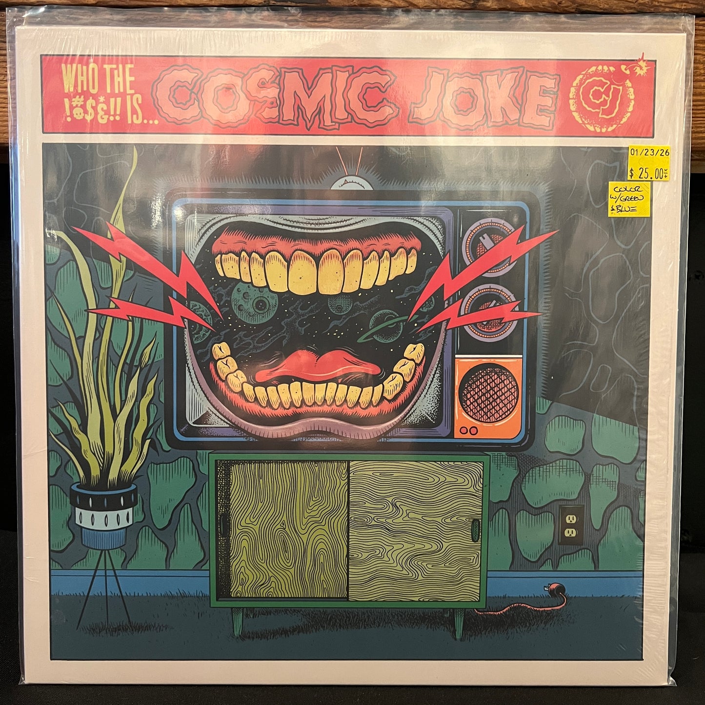 Used Vinyl: Cosmic Joke "Who The !?!&!!" LP (Clear w/Green & Blue Splatter Vinyl)