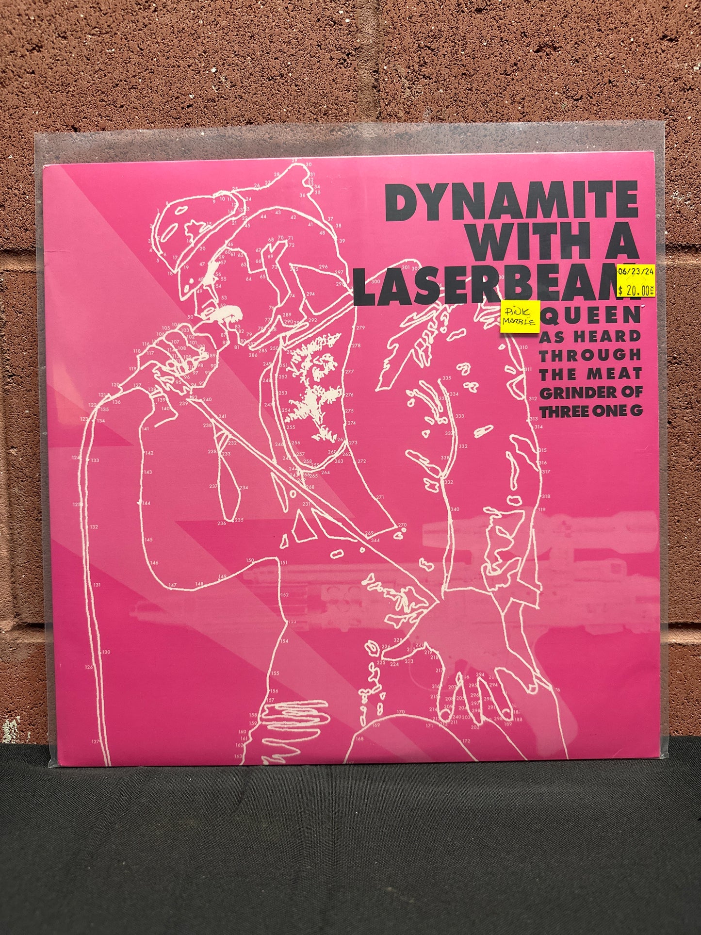 Used Vinyl:  Various ”Dynamite With A Laserbeam: Queen As Heard Through The Meat Grinder Of Three One G” LP (Pink vinyl)