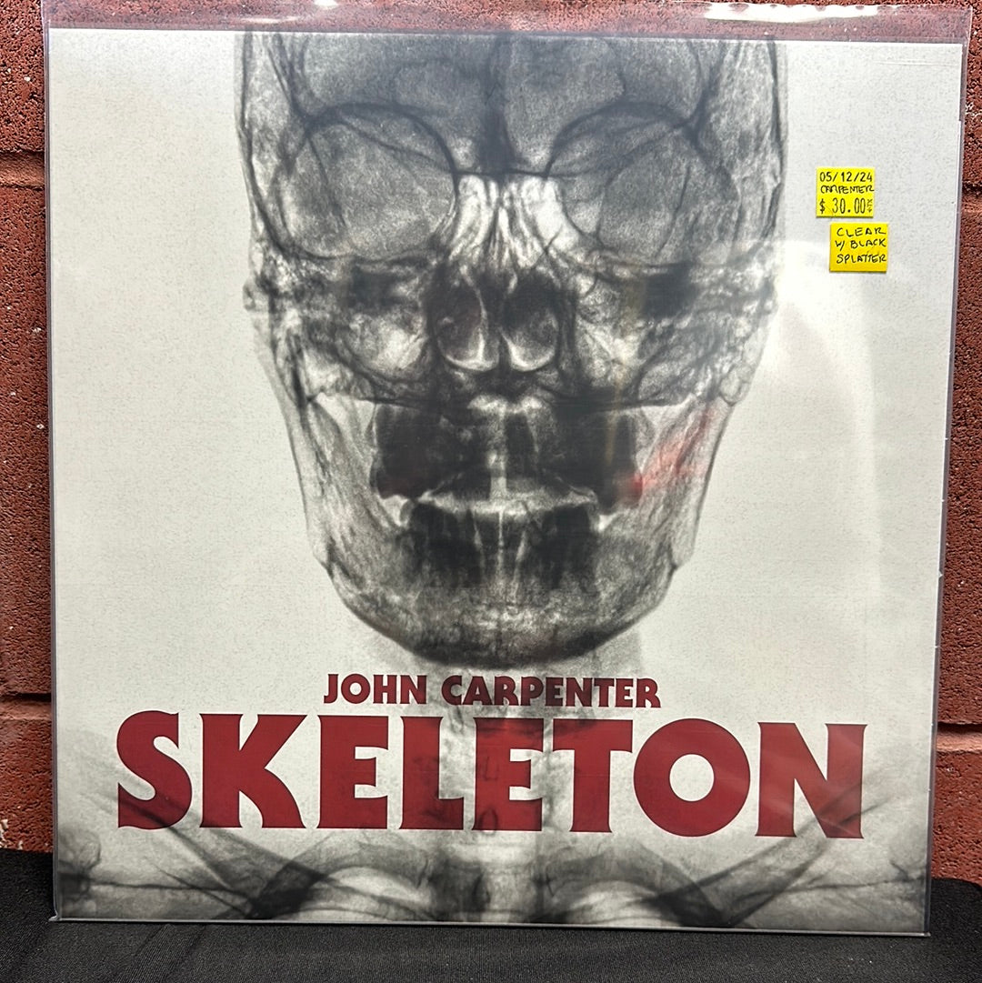 Used Vinyl:  John Carpenter ”Skeleton” 12" (Clear with black splatter vinyl)