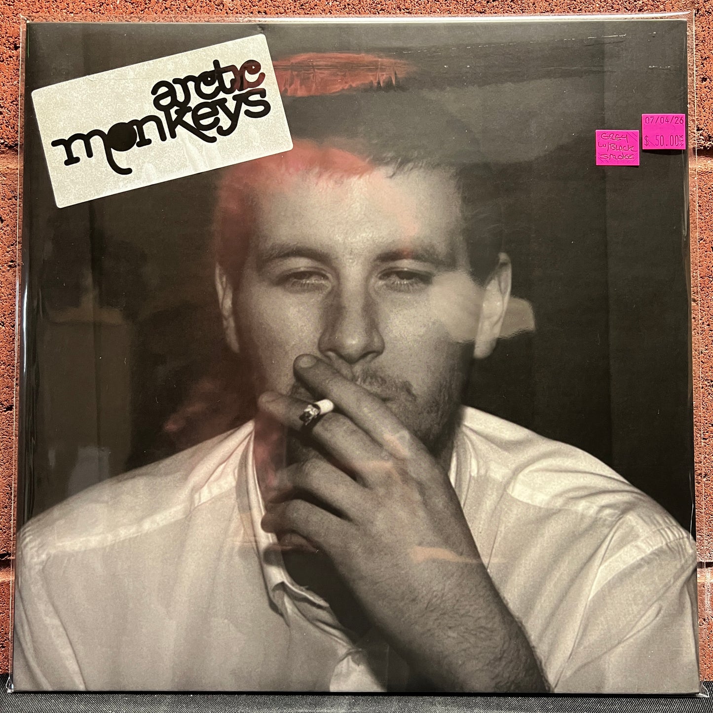 Used Vinyl: Arctic Monkeys "Whatever People Say I Am, That's What I'm Not" LP (2018 Press - Grey w/Black Smoke Vinyl)
