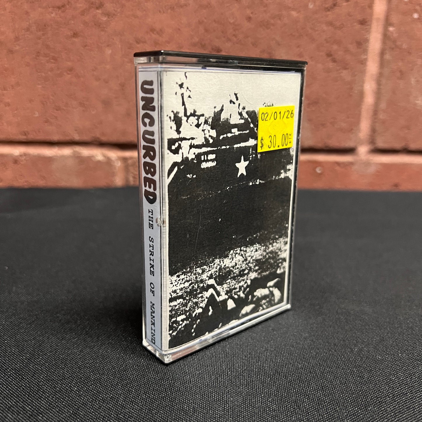 USED CASSETTE: Uncurbed "The Strike Of Mankind" Cassette