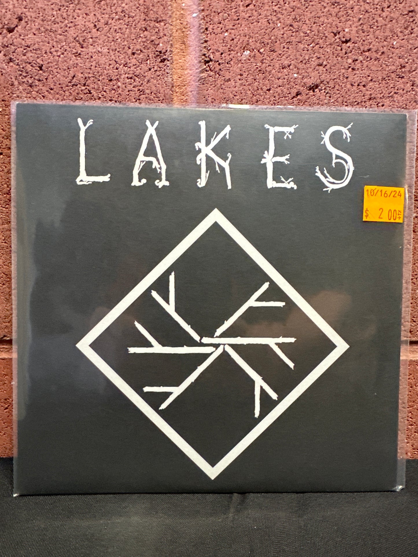 Used Vinyl:  Lakes ”Carved Remains / A Face In The Ash” 7"