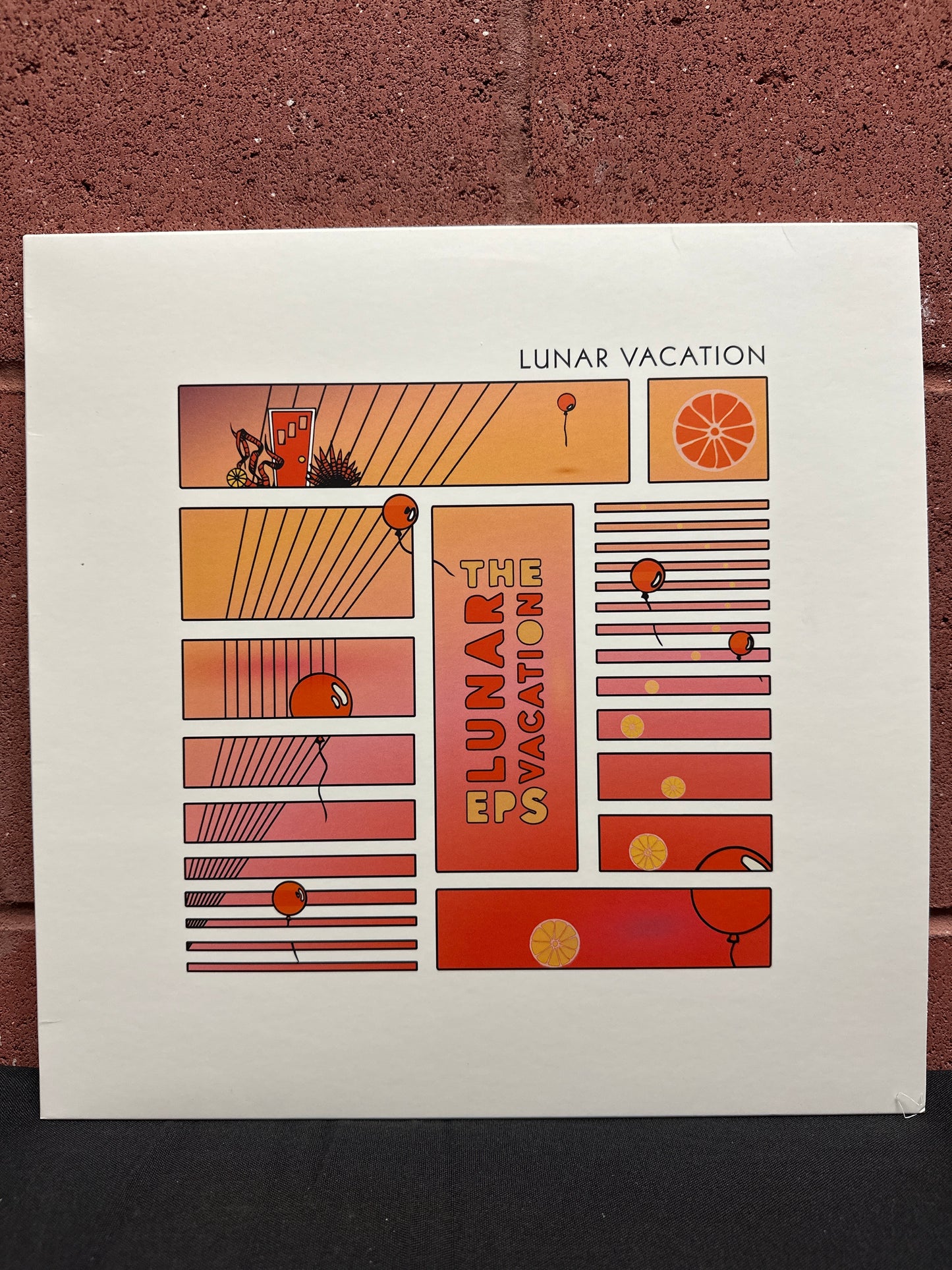 Used Vinyl:  Lunar Vacation ”The Lunar Vacation EPs” LP (Orange/blue split colored vinyl)