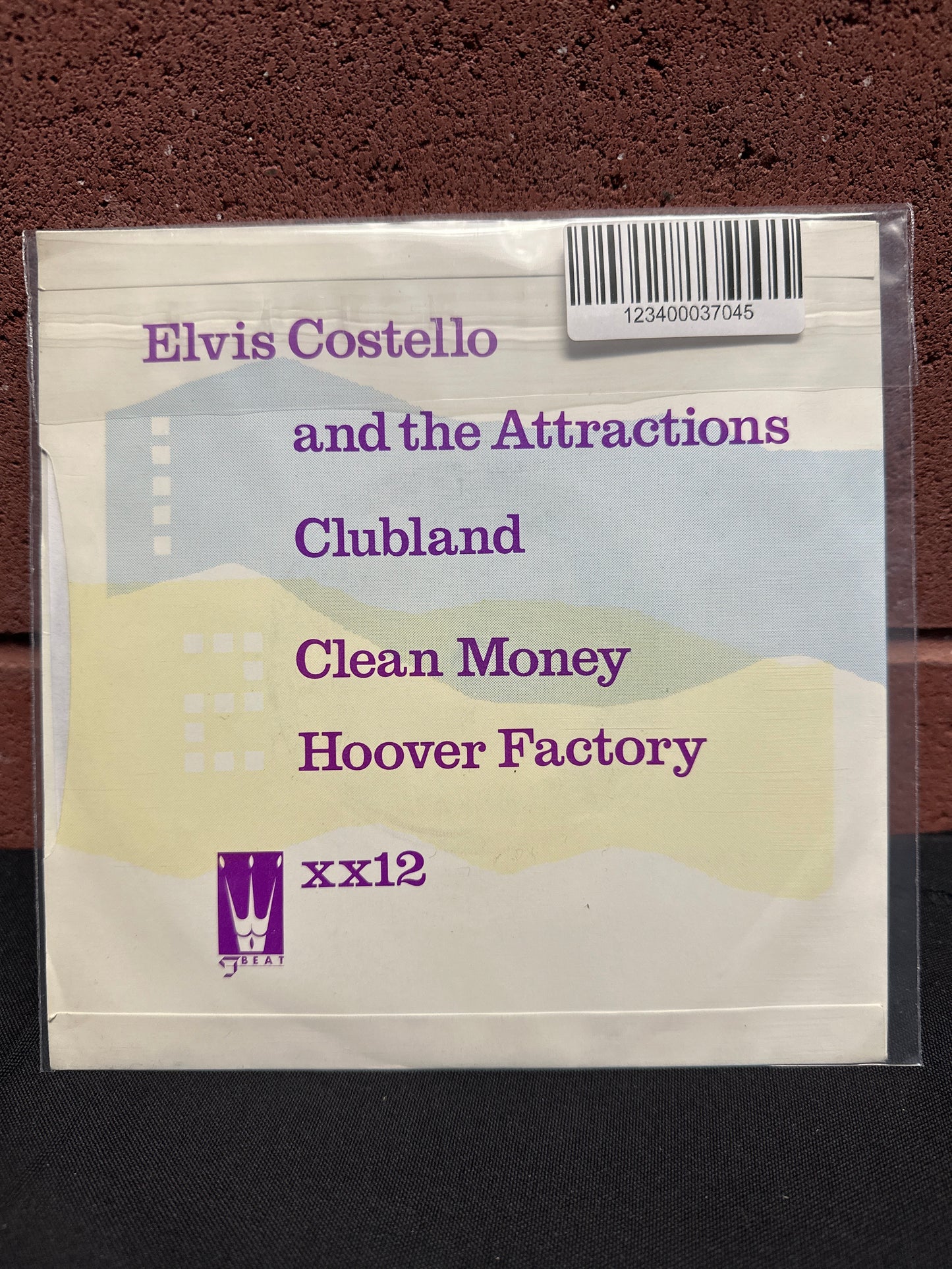 Used Vinyl:  Elvis Costello & The Attractions ”Clubland / Clean Money / Hoover Factory” 7"