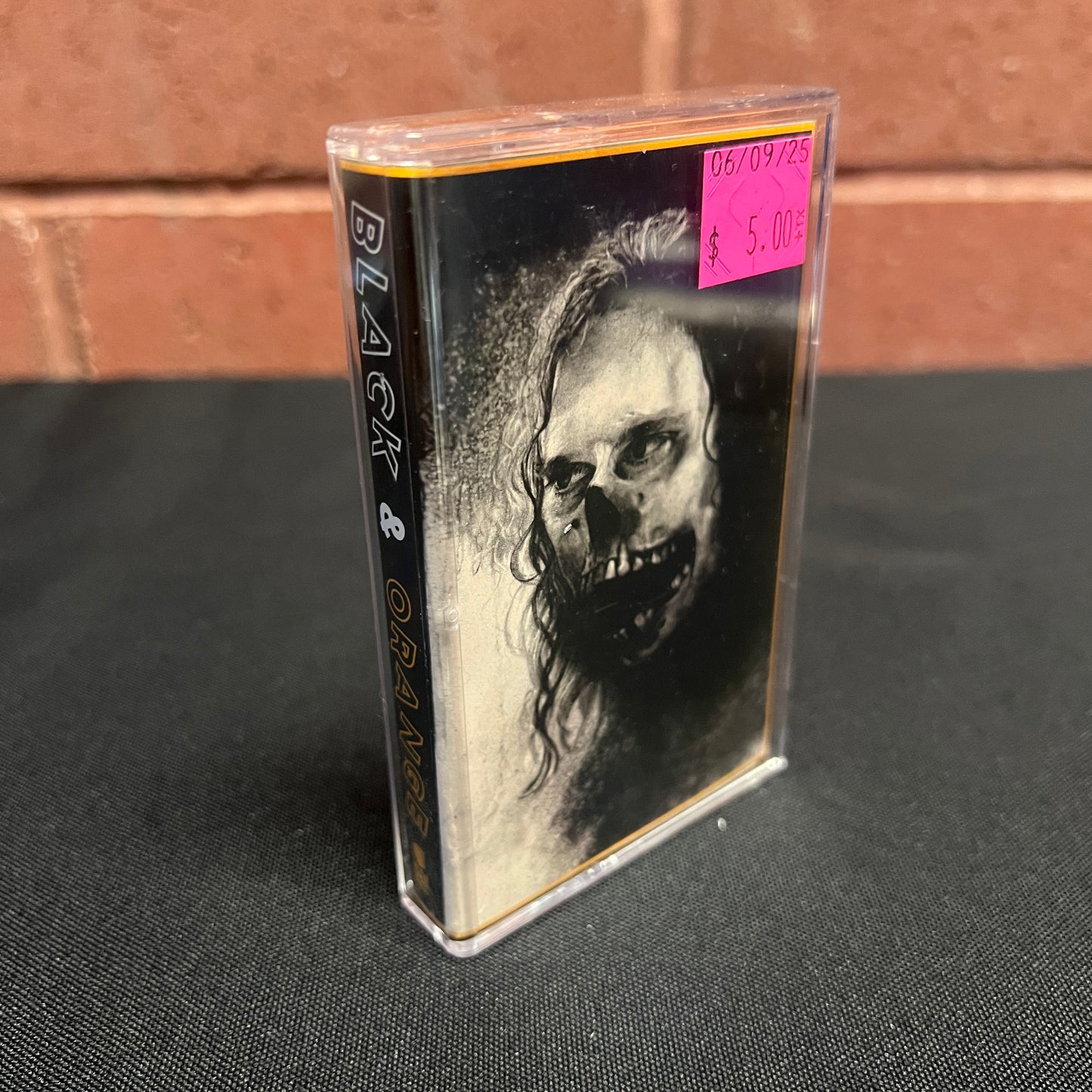 Used Cassette: Dino Stamatopoulos "Black & Orange" Tape