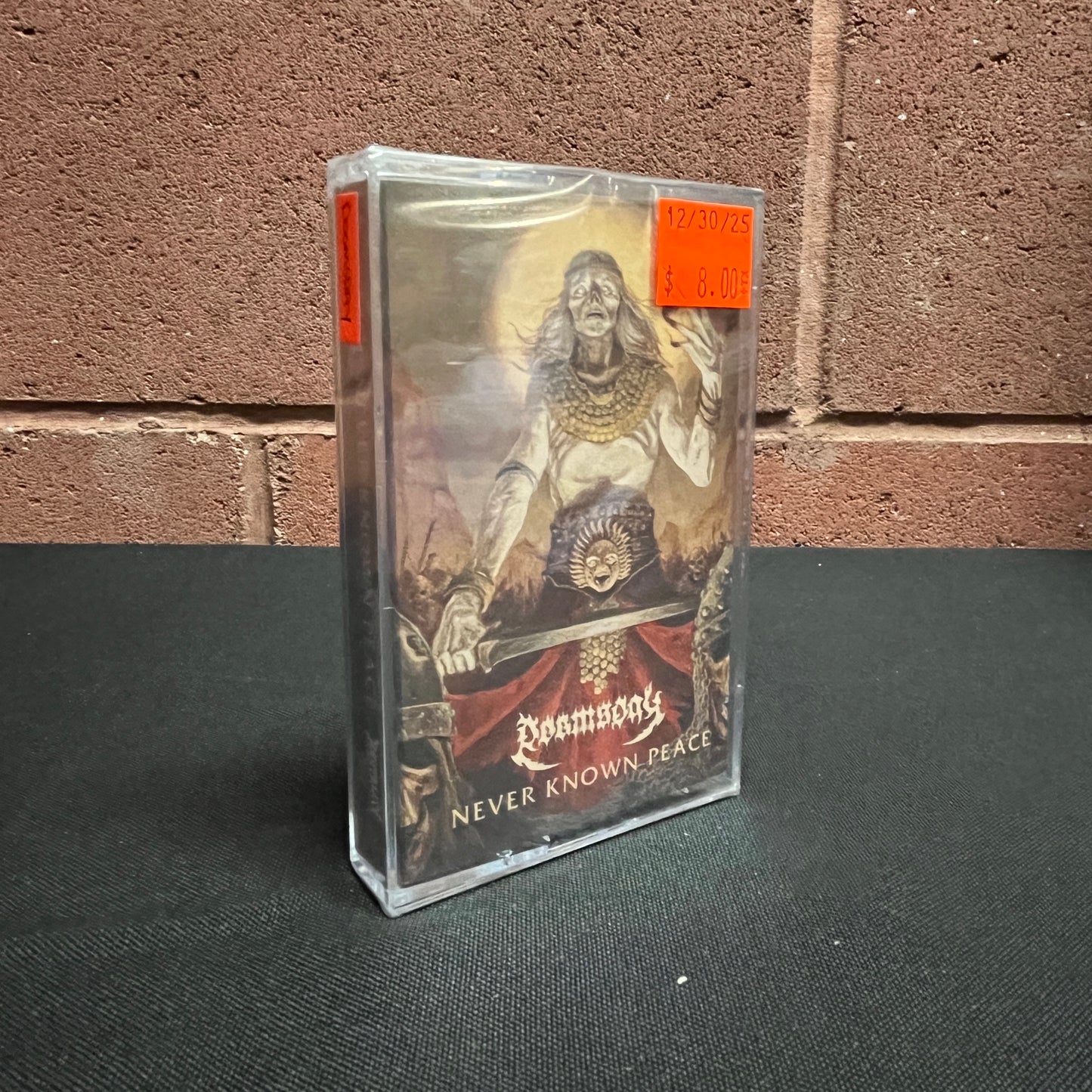 Used Cassette: Doomsday "Never Know Peace" Tape (Sealed)