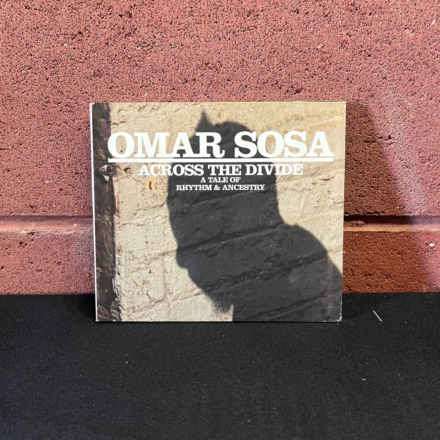 Used CD: Omar Sosa ‎"Across The Divide: A Tale Of Rhythm & Ancestry" CD