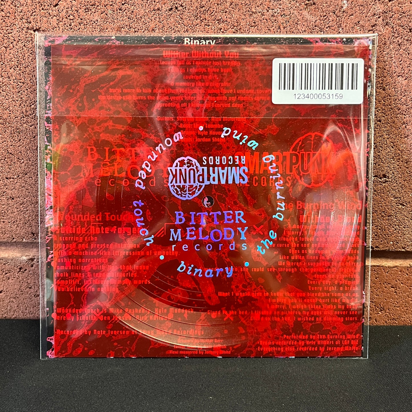 Used Vinyl: Binary / The Burning Wind / Wounded Touch "Split" 7" Flexi (Red)