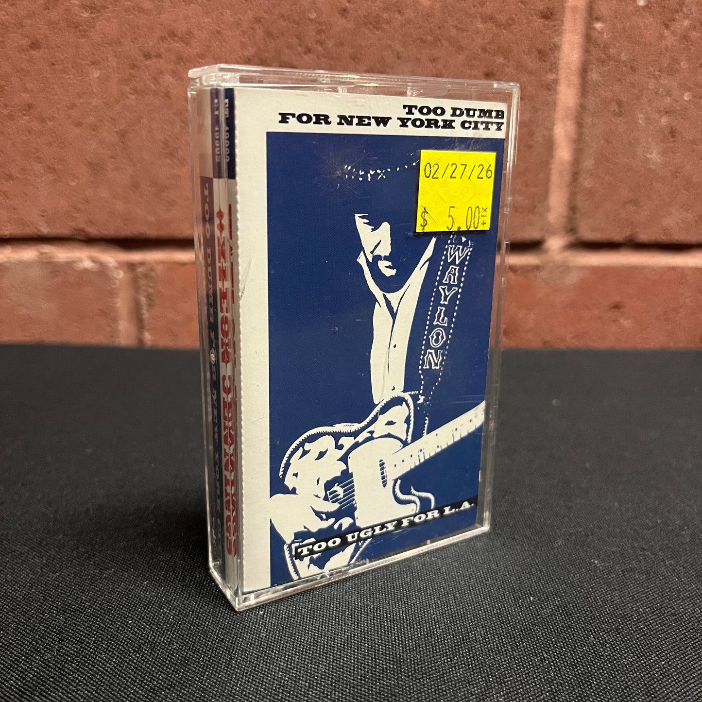 Used Cassette: Waylon Jennings "Too Dumb For New York City, Too Ugly For L.A." Tape