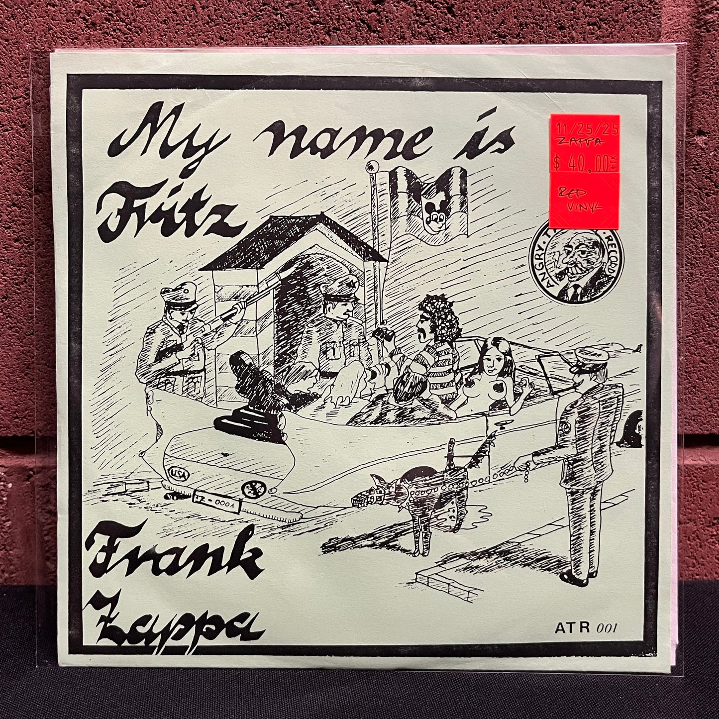 Used Vinyl: Frank Zappa "My Name Is Fritz" 7" (Green Cover Red Vinyl Press)