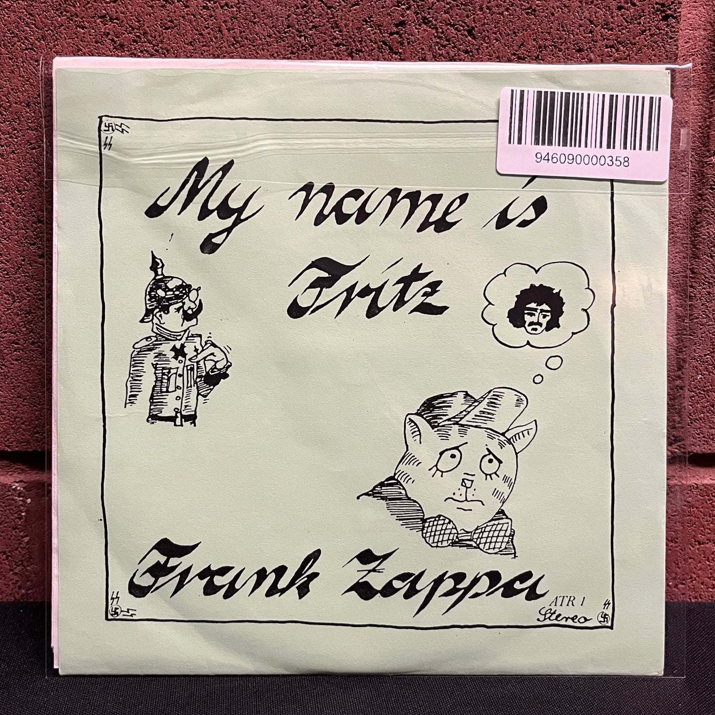 Used Vinyl: Frank Zappa "My Name Is Fritz" 7" (Green Cover Red Vinyl Press)
