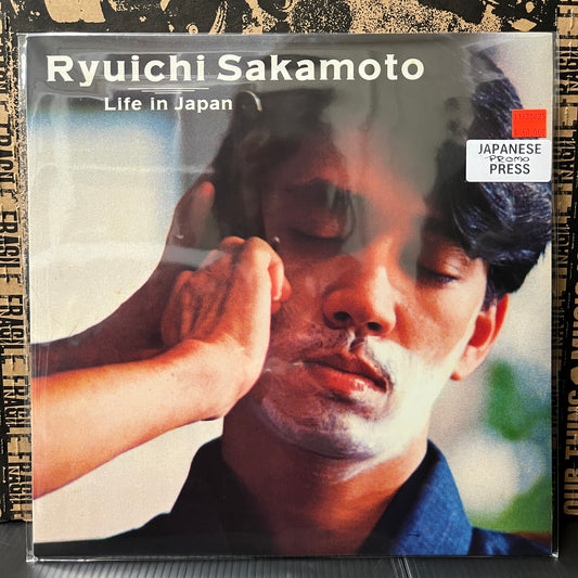 Used Vinyl: Ryuichi Sakamoto "Life In Japan" 12" (1982 Japanese Promo, Translucent Black Vinyl)