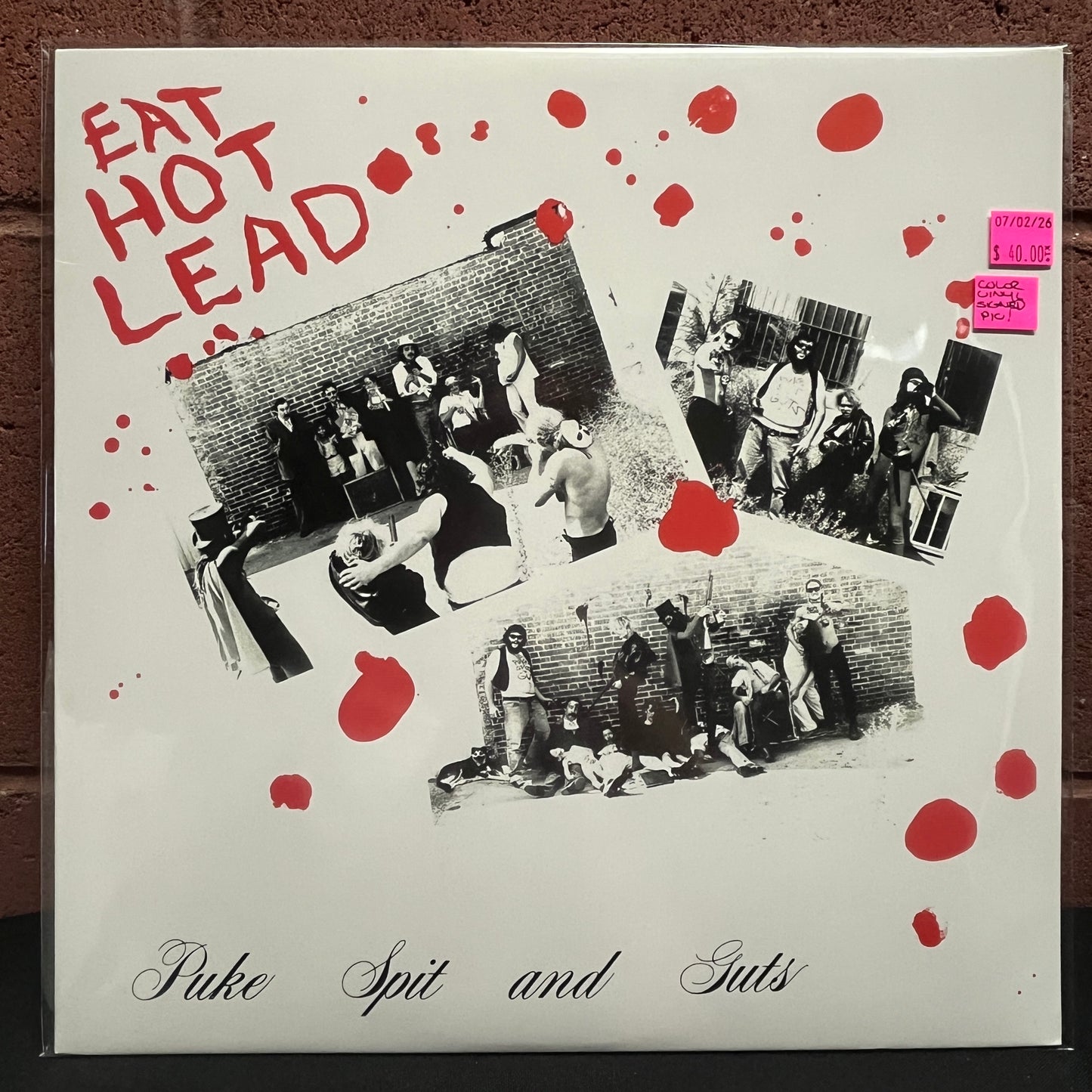 Used Vinyl: Puke Spit And Guts "Eat Hot Lead" LP (2017 Press - Clear w/Red Splatter Vinyl & Autographed insert)