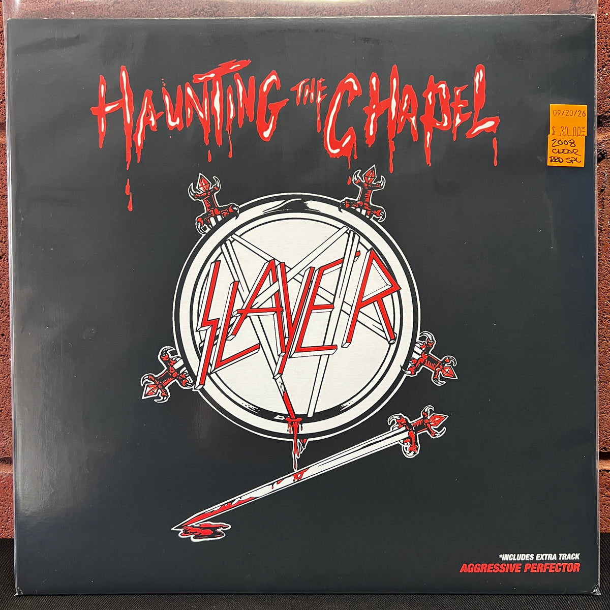 Used Vinyl: Slayer ‎"Haunting The Chapel" 12" (2008 Press - Clear w/Red Splatter Vinyl)